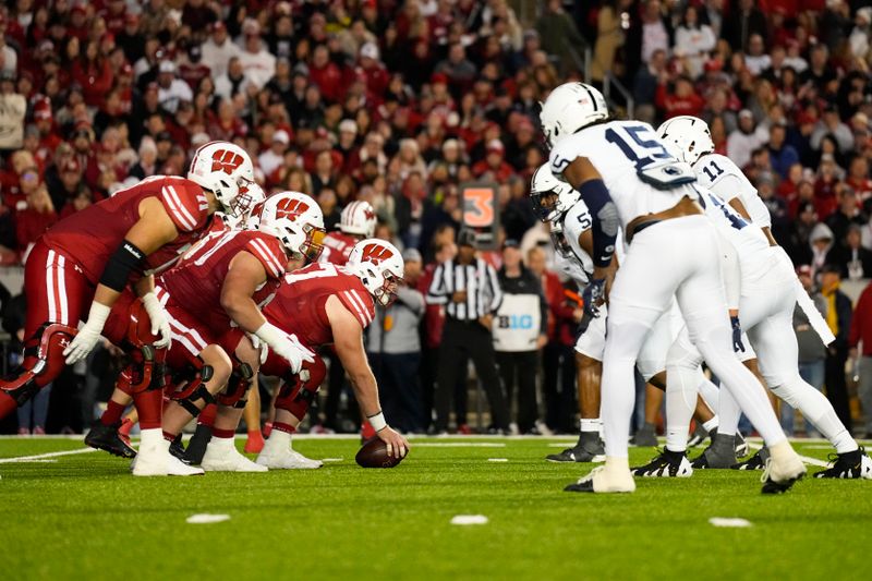 Oct 26, 2024; Madison, Wisconsin, USA;  The Wisconsin Badgers line up for a play during the third quarter against the Penn State Nittany Lions at Camp Randall Stadium. Mandatory Credit: Jeff Hanisch-Imagn Images