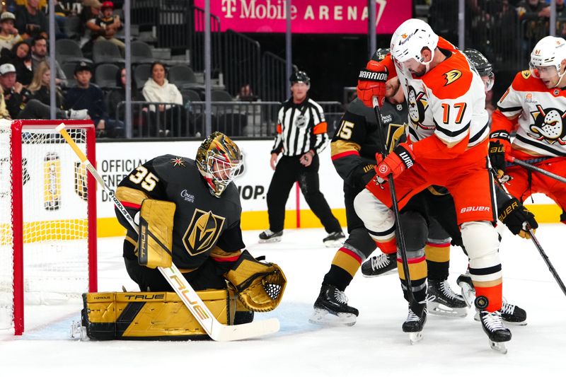 Oct 13, 2024; Las Vegas, Nevada, USA; A shot deflects off Anaheim Ducks left wing Alex Killorn (17) as Vegas Golden Knights goaltender Ilya Samsonov (35) defends his net during the third period at T-Mobile Arena. Mandatory Credit: Stephen R. Sylvanie-Imagn Images