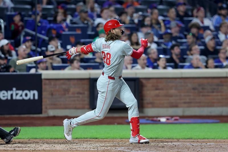 Sep 20, 2024; New York City, New York, USA; Philadelphia Phillies third baseman Alec Bohm (28) follows through on a three run home run against the New York Mets during the fourth inning at Citi Field. Mandatory Credit: Brad Penner-Imagn Images