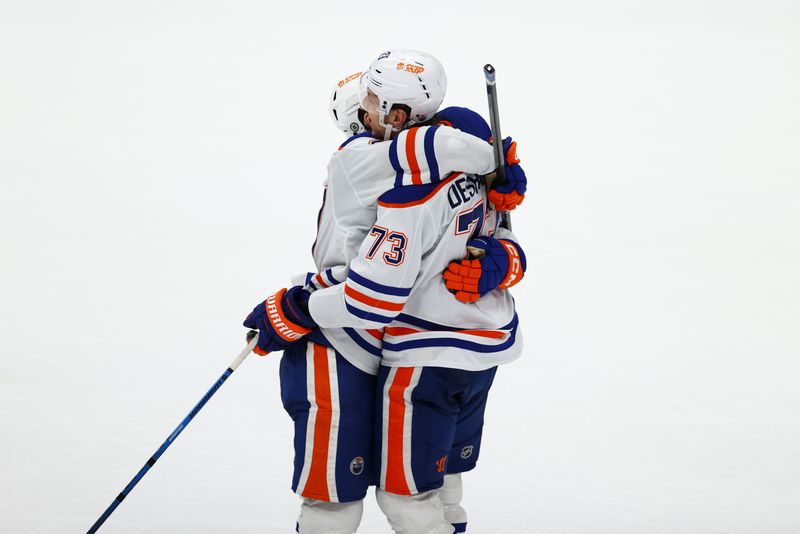 Feb 9, 2024; Anaheim, California, USA; Edmonton Oilers defenseman Vincent Desharnais (73) embraces his teammate after the Edmonton Oilers defeat the Anaheim Ducks at Honda Center. Mandatory Credit: Jessica Alcheh-USA TODAY Sports