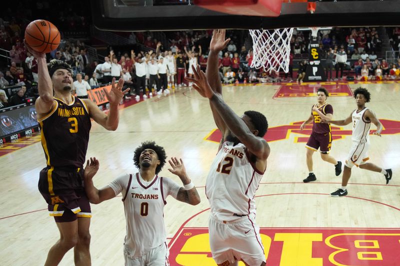 Feb 15, 2025; Los Angeles, California, USA; Minnesota Golden Gophers forward Dawson Garcia (3) shoots the ball against Southern California Trojans forward Saint Thomas (0) and forward Rashaun Agee (12) in the second half at the Galen Center. Mandatory Credit: Kirby Lee-Imagn Images