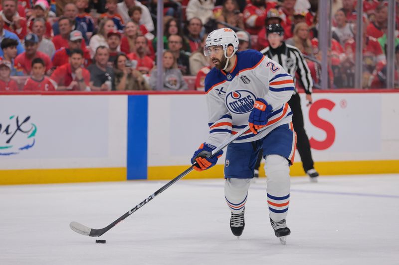 Jun 9, 2025; Sunrise, Florida, USA; Edmonton Oilers defenseman Evan Bouchard (2) controls the puck during the first period against the Florida Panthers in game three of the 2025 Stanley Cup Final at Amerant Bank Arena. Mandatory Credit: Sam Navarro-Imagn Images