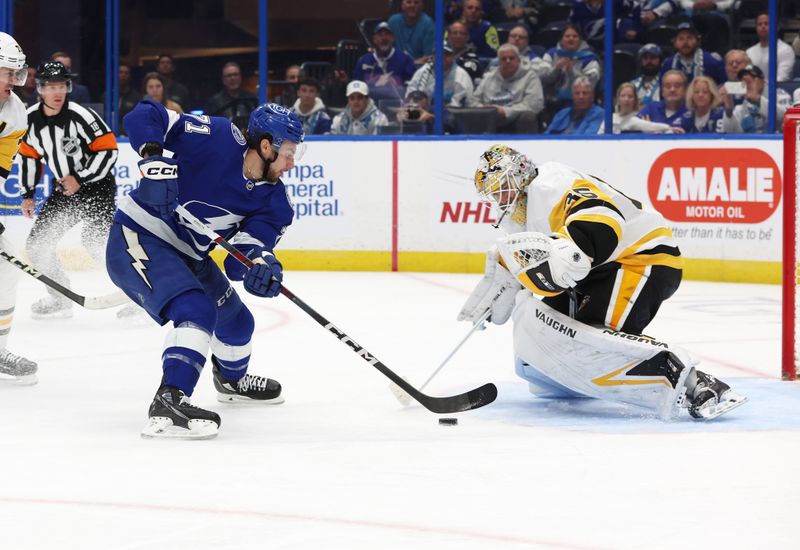 Dec 6, 2023; Tampa, Florida, USA; Tampa Bay Lightning center Anthony Cirelli (71) shoots on Pittsburgh Penguins goaltender Alex Nedeljkovic (39) during the third period at Amalie Arena. Mandatory Credit: Kim Klement Neitzel-USA TODAY Sports