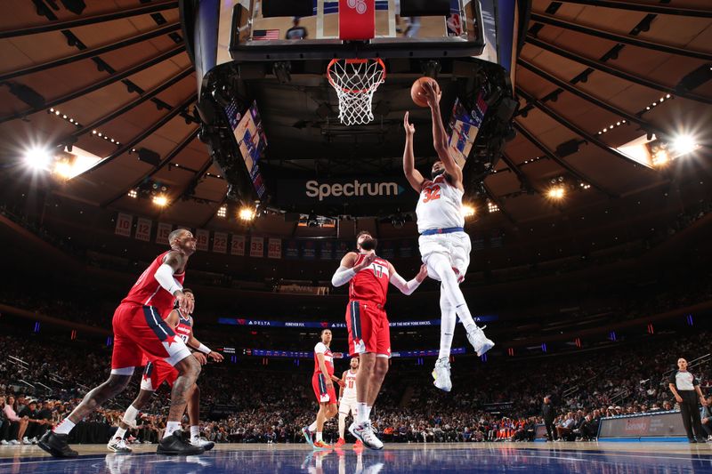 NEW YORK, NY - OCTOBER 9: Karl-Anthony Towns #32 of the New York Knicks drives to the basket during the game against the Washington Wizards during the 2024 NBA Preseason on October 9, 2024 at Madison Square Garden in New York City, New York.  NOTE TO USER: User expressly acknowledges and agrees that, by downloading and or using this photograph, User is consenting to the terms and conditions of the Getty Images License Agreement. Mandatory Copyright Notice: Copyright 2024 NBAE  (Photo by Nathaniel S. Butler/NBAE via Getty Images)