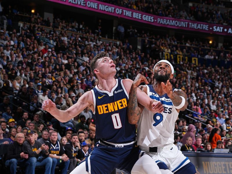 DENVER, CO - APRIL 10: Christian Braun #0 of the Denver Nuggets and Nickeil Alexander-Walker #9 of the Minnesota Timberwolves waits for a rebound during the game on April 10, 2024 at the Ball Arena in Denver, Colorado. NOTE TO USER: User expressly acknowledges and agrees that, by downloading and/or using this Photograph, user is consenting to the terms and conditions of the Getty Images License Agreement. Mandatory Copyright Notice: Copyright 2024 NBAE (Photo by Garrett Ellwood/NBAE via Getty Images)