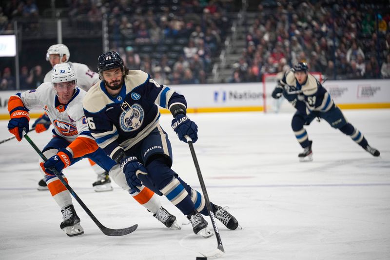 Oct 30, 2024; Columbus, Ohio, USA; Columbus Blue Jackets right wing Kirill Marchenko (86) skates with the puck against the New York Islanders in the first period at Nationwide Arena. Mandatory Credit: Samantha Madar-Imagn Images