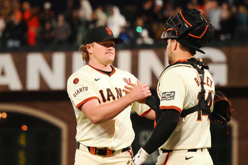 Jul 31, 2024; San Francisco, California, USA; San Francisco Giants starting pitcher Logan Webb (62) celebrates with catcher Patrick Bailey (14) after pitching a complete game against the Oakland Athletics at Oracle Park. Mandatory Credit: Kelley L Cox-USA TODAY Sports