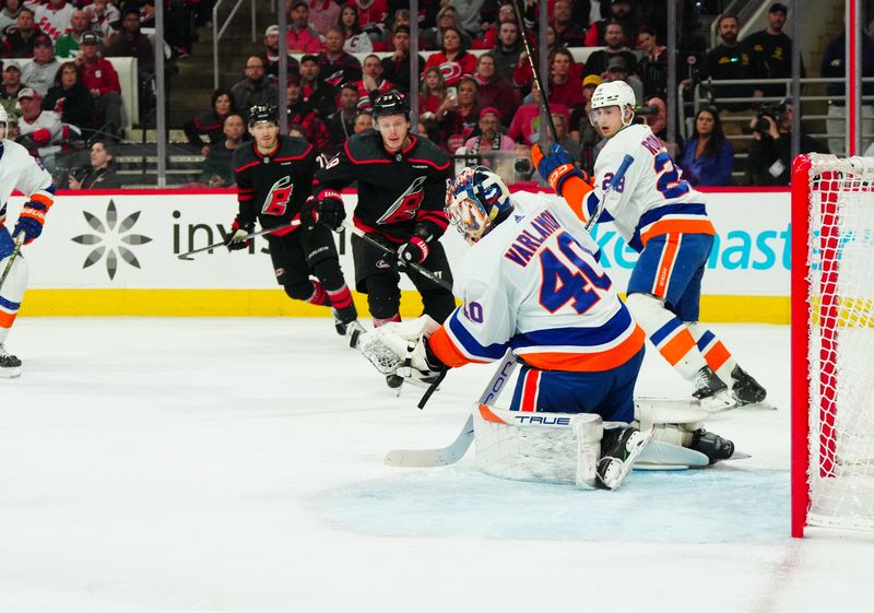 Apr 22, 2024; Raleigh, North Carolina, USA; New York Islanders goaltender Semyon Varlamov (40) stops a shot against Carolina Hurricanes center Jake Guentzel (59) during the first period in game two of the first round of the 2024 Stanley Cup Playoffs at PNC Arena. Mandatory Credit: James Guillory-USA TODAY Sports