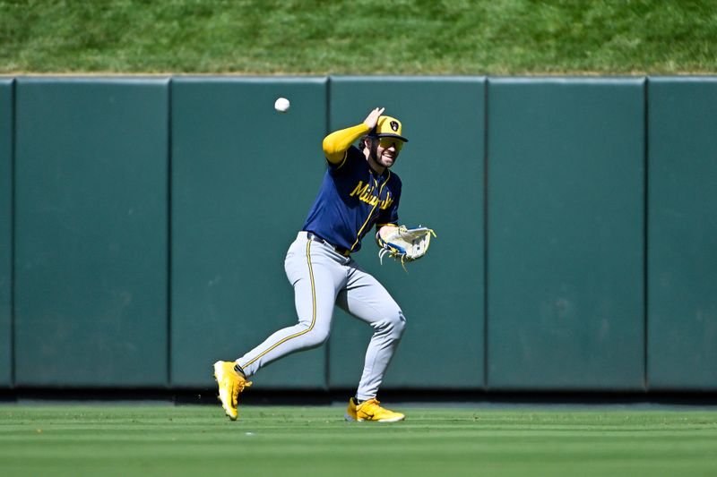 Aug 22, 2024; St. Louis, Missouri, USA;  Milwaukee Brewers center fielder Garrett Mitchell (5) drops a fly ball hit by St. Louis Cardinals shortstop Masyn Winn (not pictured) during the eighth inning at Busch Stadium. Mandatory Credit: Jeff Curry-USA TODAY Sports