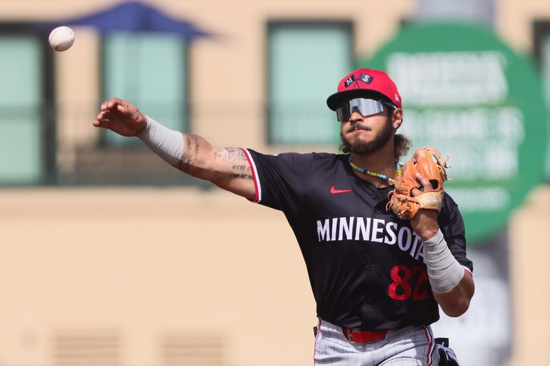 Mar 5, 2024; Jupiter, Florida, USA; Minnesota Twins second baseman Austin Martin (82) throws to first base to retire St. Louis Cardinals second baseman Brendan Donovan (not pictured) during the third inning at Roger Dean Chevrolet Stadium. Mandatory Credit: Sam Navarro-USA TODAY Sports