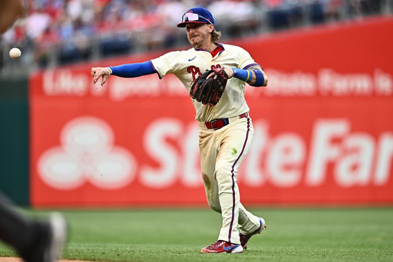 Jun 5, 2024; Philadelphia, Pennsylvania, USA; Philadelphia Phillies second baseman Bryson Stott (5) throws to first base against the Milwaukee Brewers in the eighth inning at Citizens Bank Park. Mandatory Credit: Kyle Ross-USA TODAY Sports