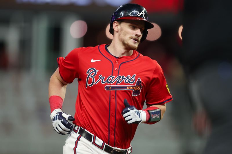 Sep 27, 2024; Atlanta, Georgia, USA; Atlanta Braves catcher Sean Murphy (12) hits a two-run home run against the Kansas City Royals in the fourth inning at Truist Park. Mandatory Credit: Brett Davis-Imagn Images