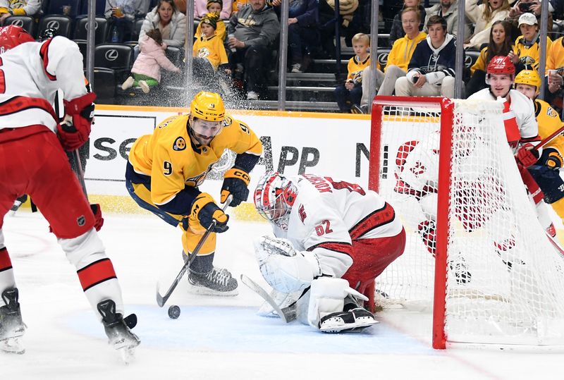 Dec 27, 2023; Nashville, Tennessee, USA; Nashville Predators left wing Filip Forsberg (9) has a shot blocked by Carolina Hurricanes goaltender Pyotr Kochetkov (52) during the third period at Bridgestone Arena. Mandatory Credit: Christopher Hanewinckel-USA TODAY Sports