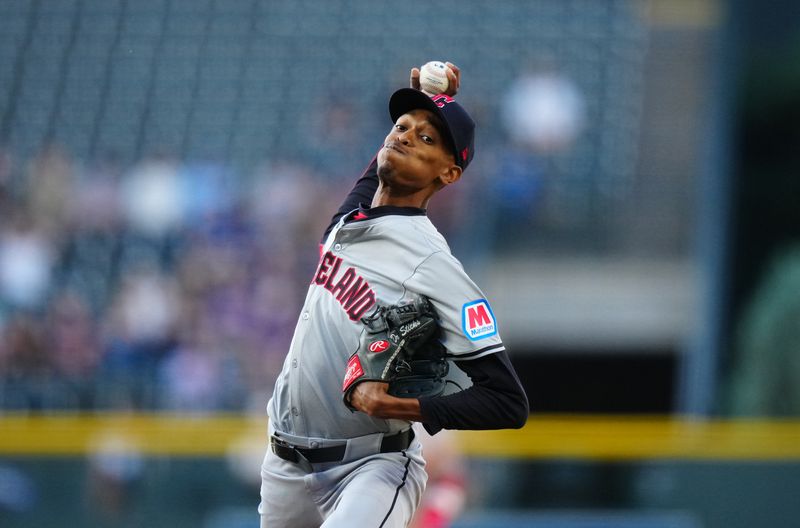 May 28, 2024; Denver, Colorado, USA; Cleveland Guardians pitcher Triston McKenzie (24) delivers a pitch in the first inning against the Colorado Rockies at Coors Field. Mandatory Credit: Ron Chenoy-USA TODAY Sports