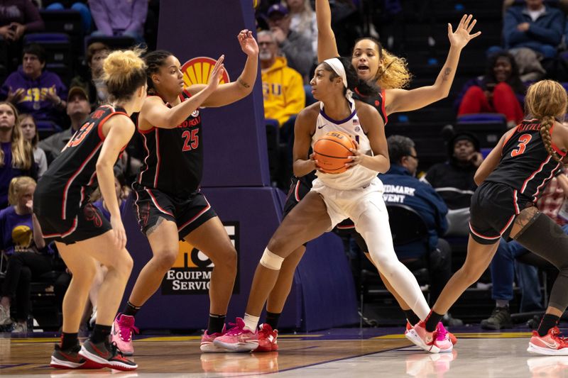 Feb 2, 2023; Baton Rouge, Louisiana, USA;  LSU Lady Tigers forward Angel Reese (10) looks to pass the ball against Georgia Lady Bulldogs forward Kari Niblack (25) during the second half at Pete Maravich Assembly Center. Mandatory Credit: Stephen Lew-USA TODAY Sports