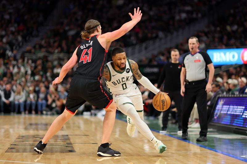 MILWAUKEE, WISCONSIN - APRIL 05: Damian Lillard #0 of the Milwaukee Bucks drives around Kelly Olynyk #41 of the Toronto Raptors during the second half of a game at Fiserv Forum on April 05, 2024 in Milwaukee, Wisconsin. NOTE TO USER: User expressly acknowledges and agrees that, by downloading and or using this photograph, User is consenting to the terms and conditions of the Getty Images License Agreement. (Photo by Stacy Revere/Getty Images)