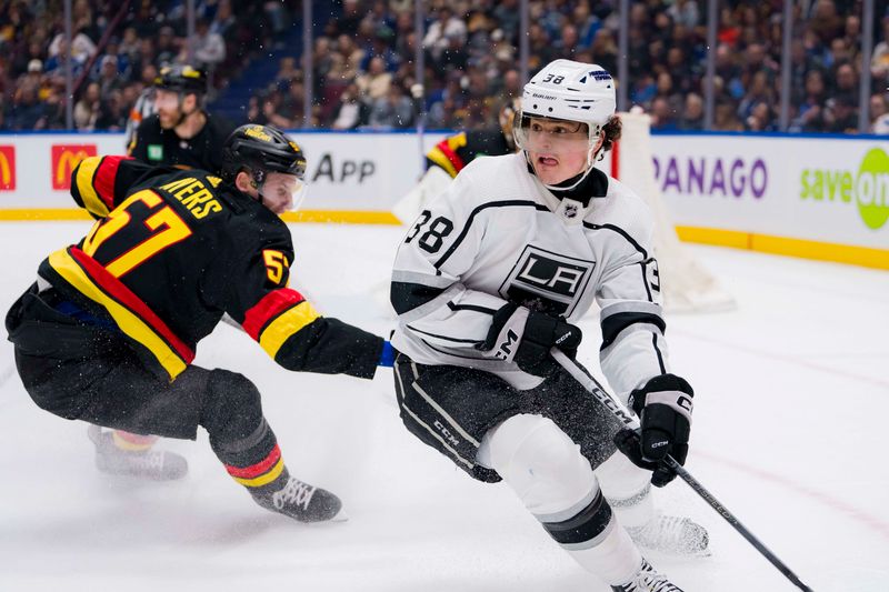 Feb 29, 2024; Vancouver, British Columbia, CAN; Vancouver Canucks defenseman Tyler Myers (57) defends against Los Angeles Kings forward Alex Turcotte (38) in the second period at Rogers Arena. Mandatory Credit: Bob Frid-USA TODAY Sports