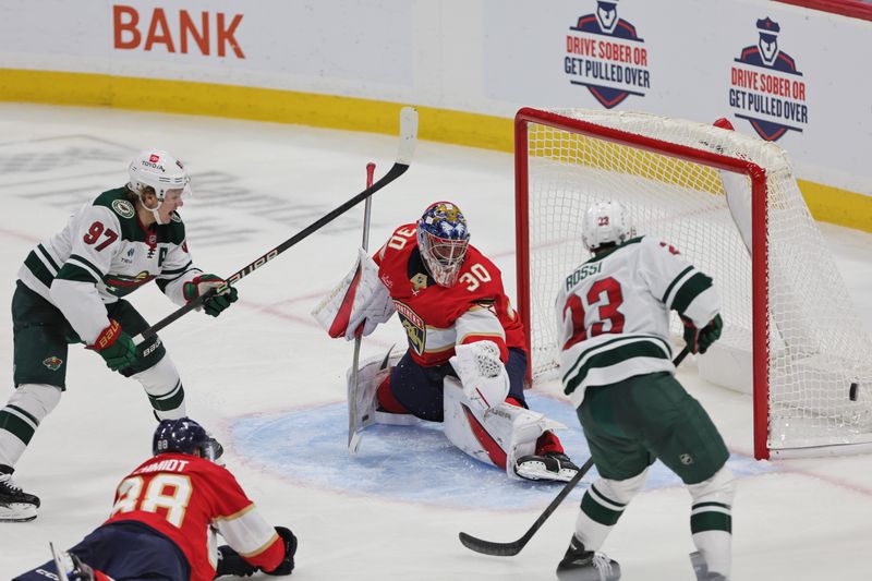 Oct 22, 2024; Sunrise, Florida, USA; Florida Panthers goaltender Spencer Knight (30) makes a save against Minnesota Wild left wing Kirill Kaprizov (97) during the third period at Amerant Bank Arena. Mandatory Credit: Sam Navarro-Imagn Images