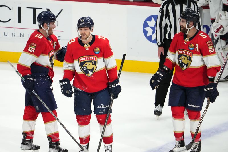 Dec 13, 2022; Sunrise, Florida, USA; Florida Panthers center Sam Reinhart (13) celebrates his empty net goal against the Columbus Blue Jackets during the third period at FLA Live Arena. Mandatory Credit: Jasen Vinlove-USA TODAY Sports