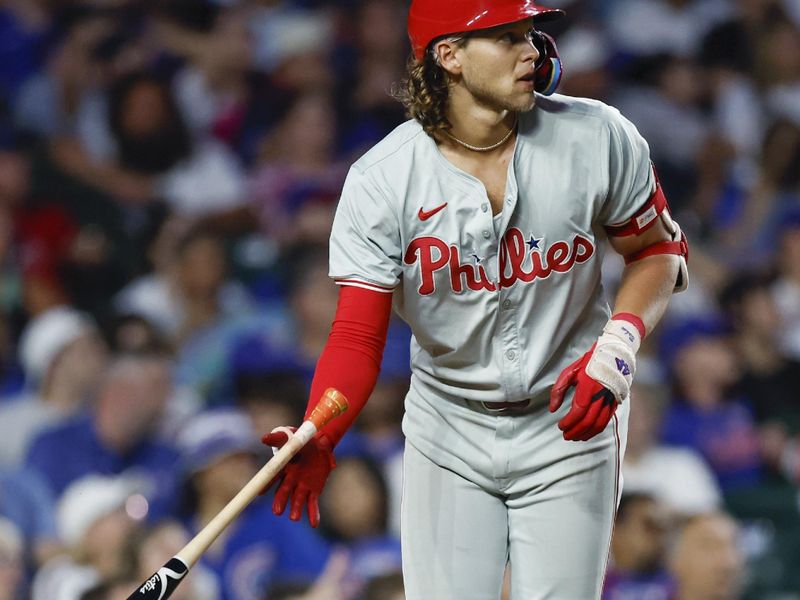 Jul 3, 2024; Chicago, Illinois, USA; Philadelphia Phillies third baseman Alec Bohm (28) watches his two-run home run against the Chicago Cubs during the sixth inning at Wrigley Field. Mandatory Credit: Kamil Krzaczynski-USA TODAY Sports