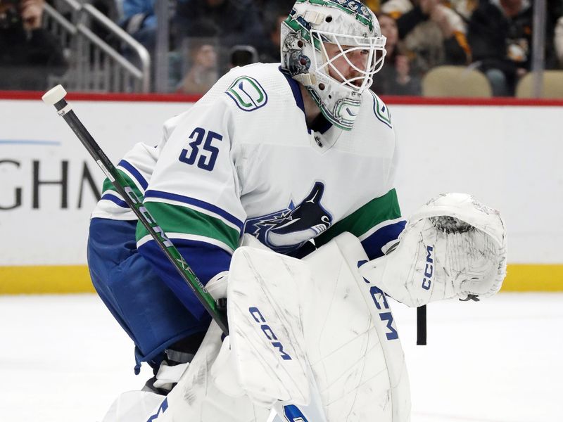 Jan 11, 2024; Pittsburgh, Pennsylvania, USA; Vancouver Canucks goaltender Thatcher Demko (35) guards the net against the Pittsburgh Penguins during the third period at PPG Paints Arena. The Canucks won 4-3 in overtime. Mandatory Credit: Charles LeClaire-USA TODAY Sports