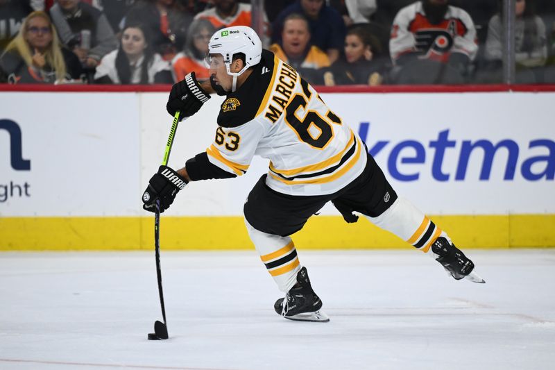 Nov 2, 2024; Philadelphia, Pennsylvania, USA; Boston Bruins left wing Brad Marchand (63) passes the puck against the Philadelphia Flyers in the second period at Wells Fargo Center. Mandatory Credit: Kyle Ross-Imagn Images