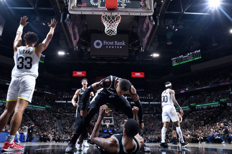 SAN ANTONIO, TX - NOVEMBER 9: Keldon Johnson #0, Zach Collins #23, and Blake Wesley #14 of the San Antonio Spurs celebrate during the game against the Utah Jazz on November 9, 2024 at the Frost Bank Center in San Antonio, Texas. NOTE TO USER: User expressly acknowledges and agrees that, by downloading and or using this photograph, user is consenting to the terms and conditions of the Getty Images License Agreement. Mandatory Copyright Notice: Copyright 2024 NBAE (Photos by Logan Riely/NBAE via Getty Images)