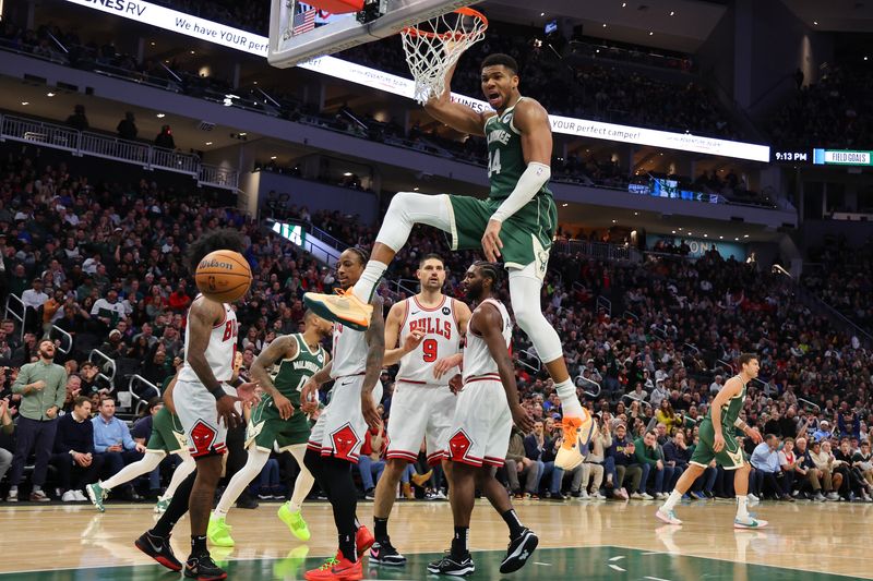 MILWAUKEE, WISCONSIN - DECEMBER 11: Giannis Antetokounmpo #34 of the Milwaukee Bucks dunks against the Chicago Bulls during a game at Fiserv Forum on December 11, 2023 in Milwaukee, Wisconsin. NOTE TO USER: User expressly acknowledges and agrees that, by downloading and or using this photograph, User is consenting to the terms and conditions of the Getty Images License Agreement. (Photo by Stacy Revere/Getty Images)