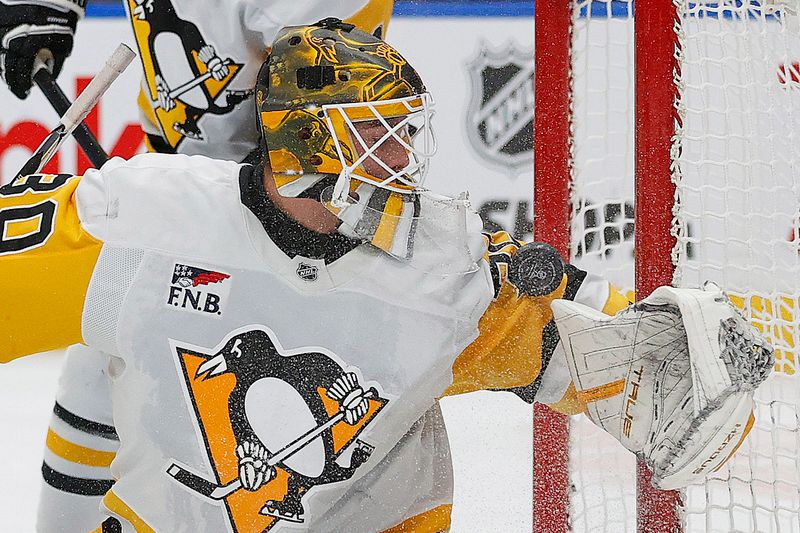 Oct 25, 2024; Edmonton, Alberta, CAN; Pittsburgh Penguins goaltender Joel Blomqvist (30) makes a save on  on a deflection by Edmonton Oilers forward Zach Hyman (18) (not shown) during the first period at Rogers Place. Mandatory Credit: Perry Nelson-Imagn Images