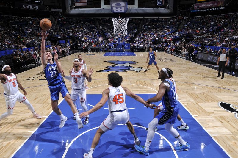 ORLANDO, FL - FEBRUARY 14: Franz Wagner #22 of the Orlando Magic drives to the basket during the game against the New York Knicks on February 14, 2024 at the Kia Center in Orlando, Florida. NOTE TO USER: User expressly acknowledges and agrees that, by downloading and or using this photograph, User is consenting to the terms and conditions of the Getty Images License Agreement. Mandatory Copyright Notice: Copyright 2024 NBAE (Photo by Fernando Medina/NBAE via Getty Images)