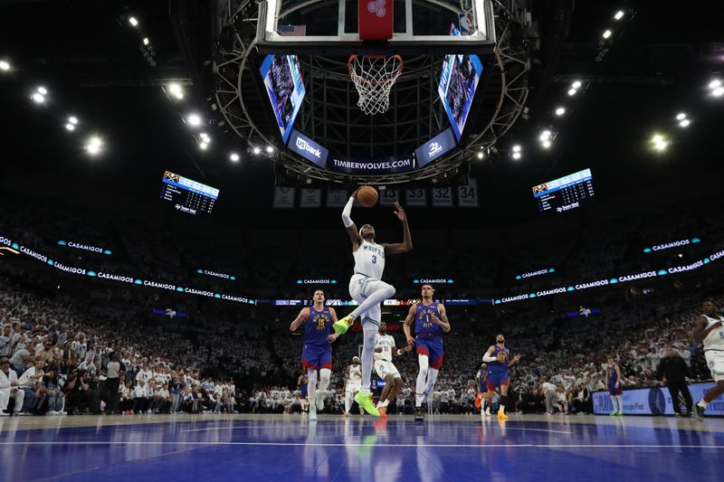 MINNEAPOLIS, MN -  MAY 16: Jaden McDaniels #3 of the Minnesota Timberwolves dunks the ball during the game against the Denver Nuggets during Round 2 Game 6 of the 2024 NBA Playoffs on May 16, 2024 at Target Center in Minneapolis, Minnesota. NOTE TO USER: User expressly acknowledges and agrees that, by downloading and or using this Photograph, user is consenting to the terms and conditions of the Getty Images License Agreement. Mandatory Copyright Notice: Copyright 2024 NBAE (Photo by Jordan Johnson/NBAE via Getty Images)