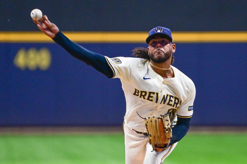 Sep 18, 2024; Milwaukee, Wisconsin, USA;  Milwaukee Brewers starting pitcher Freddy Peralta (51) pitches in the first inning against the Philadelphia Phillies at American Family Field. Mandatory Credit: Benny Sieu-Imagn Images