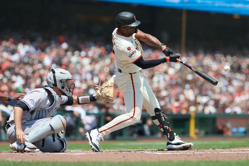 Jul 28, 2024; San Francisco, California, USA; San Francisco Giants designated hitter Jorge Soler (2) hits an RBI triple against the Colorado Rockies during the second inning at Oracle Park. Mandatory Credit: Robert Edwards-USA TODAY Sports