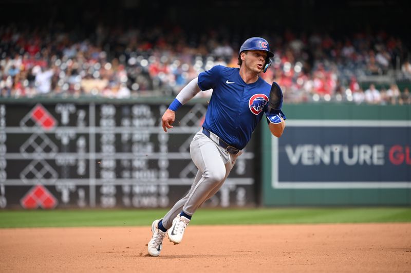 Sep 1, 2024; Washington, District of Columbia, USA; Chicago Cubs second baseman Nico Hoerner (2) sprints to third base against the Washington Nationals during the fourth inning at Nationals Park. Mandatory Credit: Rafael Suanes-USA TODAY Sports