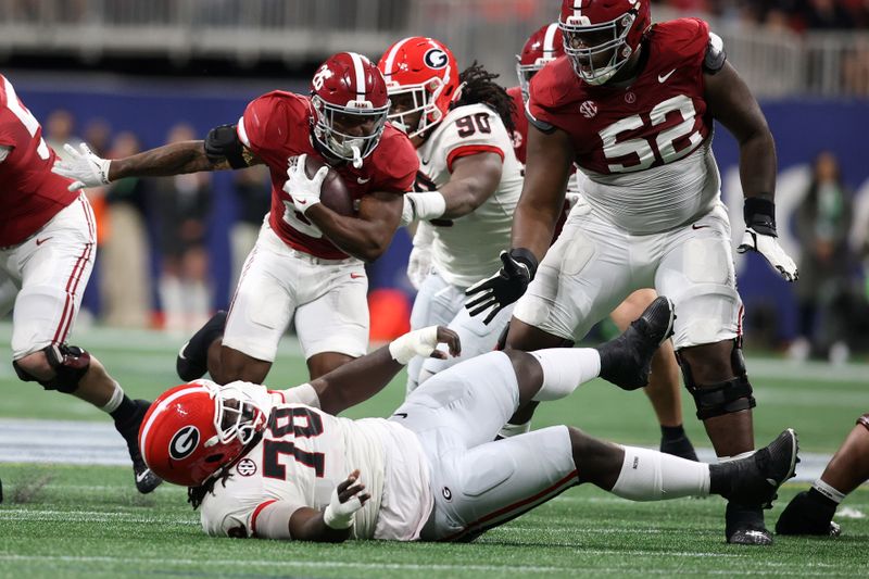 Dec 2, 2023; Atlanta, GA, USA; Alabama Crimson Tide running back Jam Miller (26) rushes the ball against the Georgia Bulldogs during the first half of the SEC Championship game at Mercedes-Benz Stadium. Mandatory Credit: Brett Davis-USA TODAY Sports