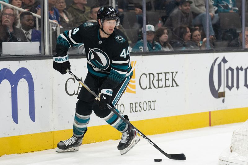 Mar 7, 2024; San Jose, California, USA; San Jose Sharks defenseman Marc-Edouard Vlasic (44) controls the puck during the first period against the New York Islanders at SAP Center at San Jose. Mandatory Credit: Stan Szeto-USA TODAY Sports