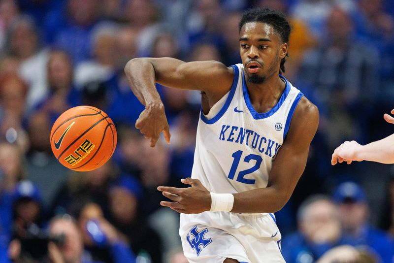 Feb 24, 2024; Lexington, Kentucky, USA; Kentucky Wildcats guard Antonio Reeves (12) passes the ball behind his back during the first half against the Alabama Crimson Tide at Rupp Arena at Central Bank Center. Mandatory Credit: Jordan Prather-USA TODAY Sports