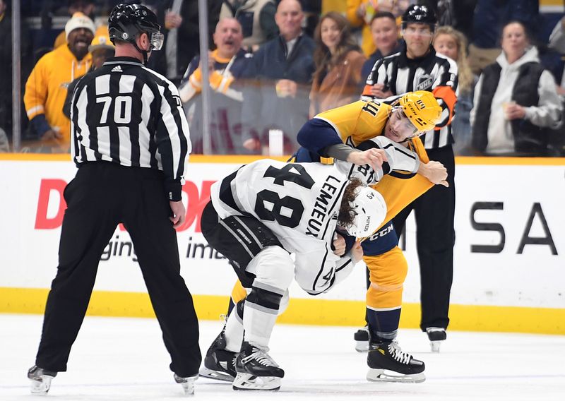 Jan 21, 2023; Nashville, Tennessee, USA; Los Angeles Kings left wing Brendan Lemieux (48) and Nashville Predators left wing Tanner Jeannot (84) exchange punches during a fight in the first period at Bridgestone Arena. Mandatory Credit: Christopher Hanewinckel-USA TODAY Sports