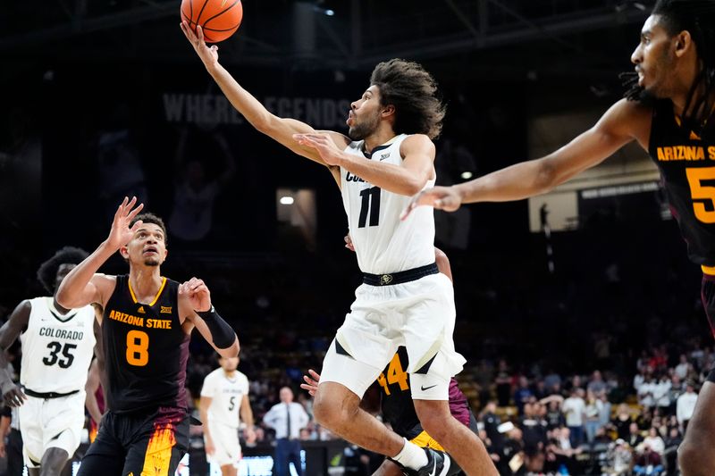 Jan 28, 2025; Boulder, Colorado, USA; Colorado Buffaloes guard Javon Ruffin (11) shoots the ball in the second half against the Arizona State Sun Devils at CU Events Center. Mandatory Credit: Ron Chenoy-Imagn Images