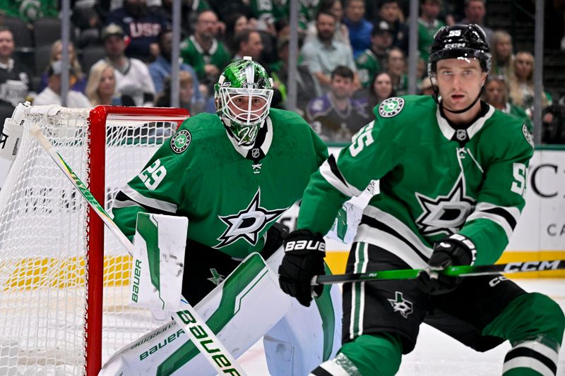 Oct 23, 2025; Dallas, Texas, USA; Dallas Stars goaltender Jake Oettinger (29) and defenseman Thomas Harley (55) faces the Los Angeles Kings attack during the first period at the American Airlines Center. Mandatory Credit: Jerome Miron-Imagn Images