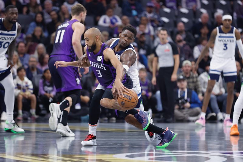 SACRAMENTO, CALIFORNIA - NOVEMBER 15: Anthony Edwards #5 of the Minnesota Timberwolves competes for the ball against Jordan McLaughlin #3 of the Sacramento Kings in the first quarter during the Emirates NBA Cup game at Golden 1 Center on November 15, 2024 in Sacramento, California. NOTE TO USER: User expressly acknowledges and agrees that, by downloading and or using this photograph, User is consenting to the terms and conditions of the Getty Images License Agreement (Photo by Lachlan Cunningham/Getty Images)