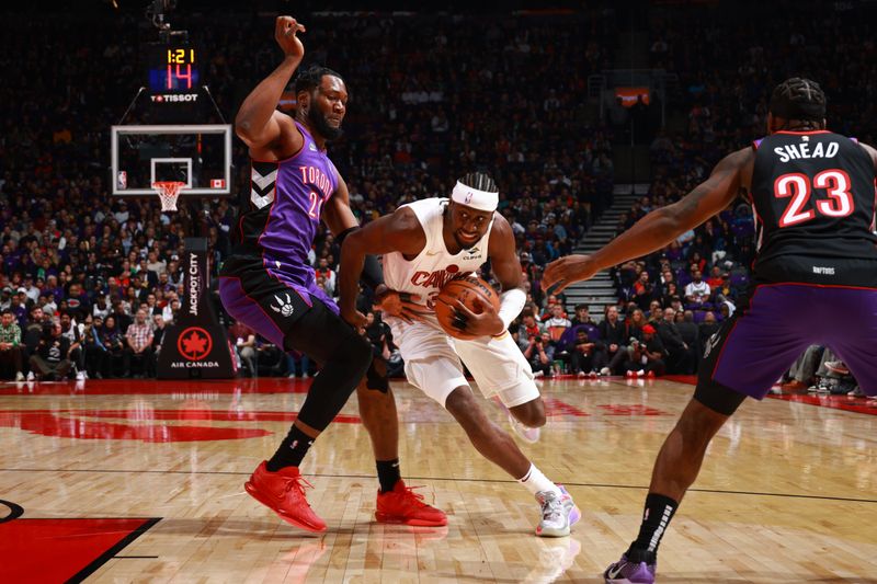 TORONTO, CANADA - OCTOBER 23: Caris LeVert #3 of the Cleveland Cavaliers drives to the basket during the game against the Toronto Raptors on October 23, 2024 at the Scotiabank Arena in Toronto, Ontario, Canada.  NOTE TO USER: User expressly acknowledges and agrees that, by downloading and or using this Photograph, user is consenting to the terms and conditions of the Getty Images License Agreement.  Mandatory Copyright Notice: Copyright 2024 NBAE (Photo by Vaughn Ridley/NBAE via Getty Images)