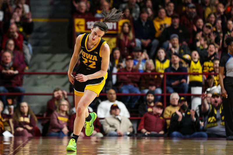 Feb 28, 2024; Minneapolis, Minnesota, USA; Iowa Hawkeyes guard Caitlin Clark (22) reacts to her three-point basket against the Minnesota Golden Gophers during the first half at Williams Arena. Mandatory Credit: Matt Krohn-USA TODAY Sports