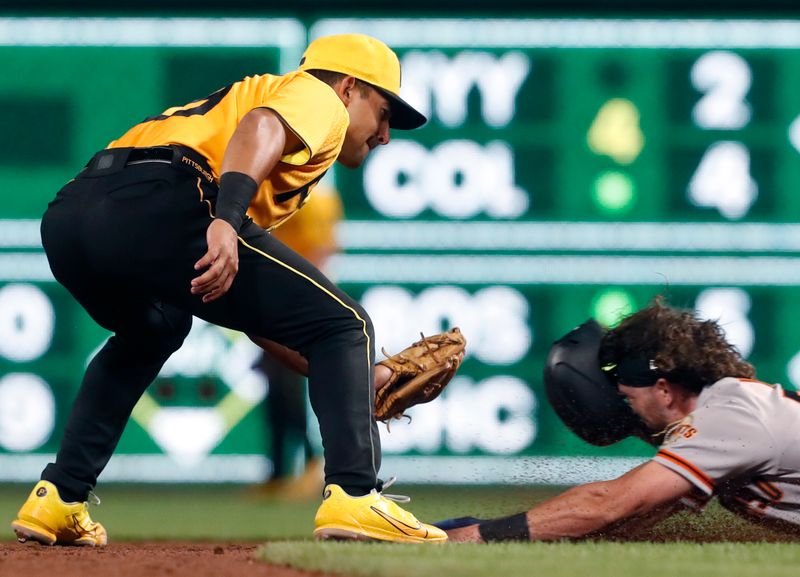 Jul 14, 2023; Pittsburgh, Pennsylvania, USA;  Pittsburgh Pirates second baseman Nick Gonzales (39) tags out San Francisco Giants pinch runner Brett Wisely (70) attempting to steal second base during the ninth inning at PNC Park. The Giants won 6-4. Mandatory Credit: Charles LeClaire-USA TODAY Sports