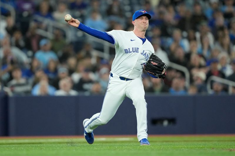 Apr 16, 2024; Toronto, Ontario, CAN; Toronto Blue Jays pitcher Trevor Richards (33) throws out New York Yankees catcher Jose Trevino (not pictured) at first base during the seventh inning at Rogers Centre. Mandatory Credit: John E. Sokolowski-USA TODAY Sports