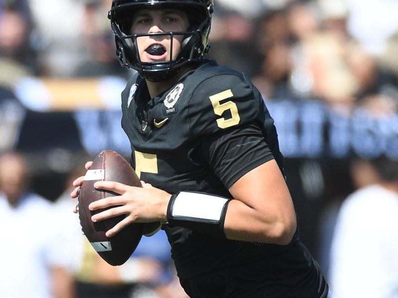 Sep 23, 2023; Nashville, Tennessee, USA; Vanderbilt Commodores quarterback AJ Swann (5) drops back to pass against the Kentucky Wildcats during the first half at FirstBank Stadium. Mandatory Credit: Christopher Hanewinckel-USA TODAY Sports