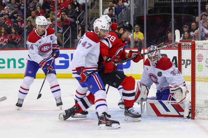 Jan 17, 2024; Newark, New Jersey, USA; Montreal Canadiens goaltender Sam Montembeault (35) makes a save on New Jersey Devils right wing Timo Meier (28)  during the second period at Prudential Center. Mandatory Credit: Ed Mulholland-USA TODAY Sports