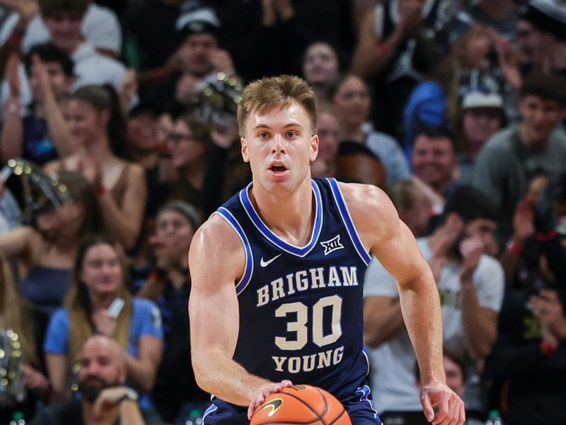 Jan 13, 2024; Orlando, Florida, USA; Brigham Young Cougars guard Dallin Hall (30) brings the ball up court during the first period against the UCF Knights at Addition Financial Arena. Mandatory Credit: Mike Watters-USA TODAY Sports