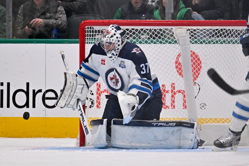 Feb 2, 2026; Dallas, Texas, USA; Winnipeg Jets goaltender Connor Hellebuyck (37) faces the Dallas Stars attack during the first period at the American Airlines Center. Mandatory Credit: Jerome Miron-Imagn Images