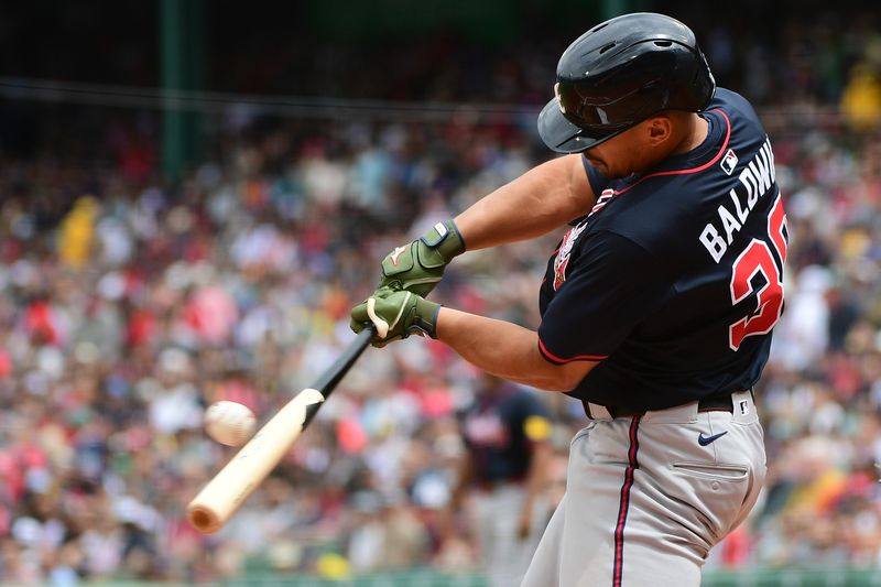 May 18, 2025; Boston, Massachusetts, USA; Atlanta Braves catcher Drake Baldwin (30) hits an RBI single during the first inning against the Boston Red Sox at Fenway Park. Mandatory Credit: Bob DeChiara-Imagn Images